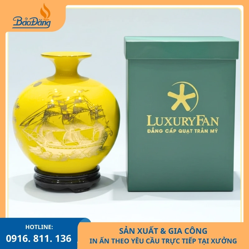 Bình hút lộc Thuận Buồm Xuôi Gió màu vàng in logo công ty.